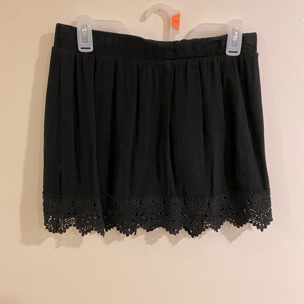 Black skirt with lace detail. Size large.